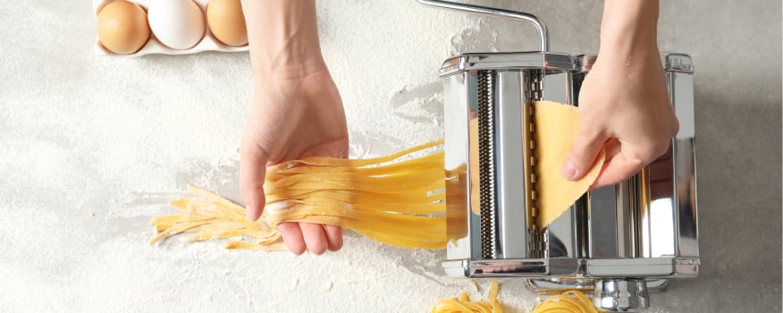 Someone making fresh pasta by hand